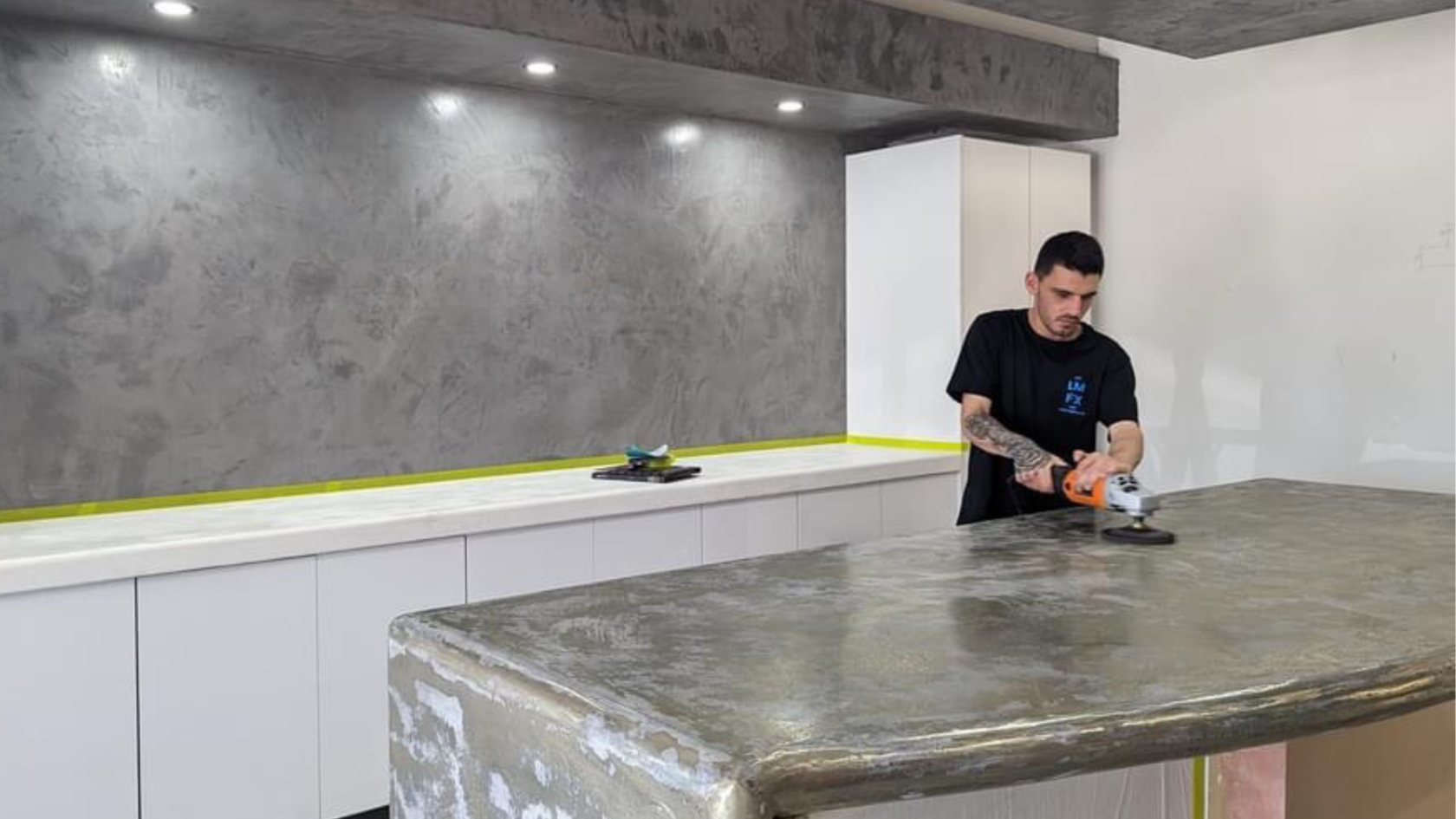 Cemento tradesman finishing a micro cement benchtop in a modern Perth kitchen